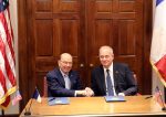 Secretary of Commerce Wilbur Ross and CNES President Jean-Yves Le Gall shake hands