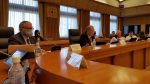 Kevin O'Connell (far left) and U.S. delegation at conference table