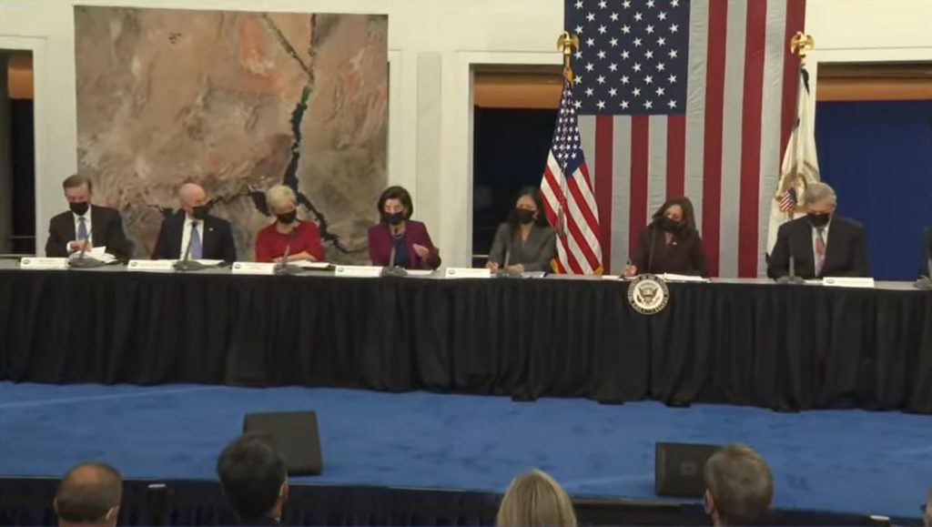 Secretary of Commerce Gina Raimondo (center) addresses Vice President Kamala Harris (2nd from right) and the National Space Council