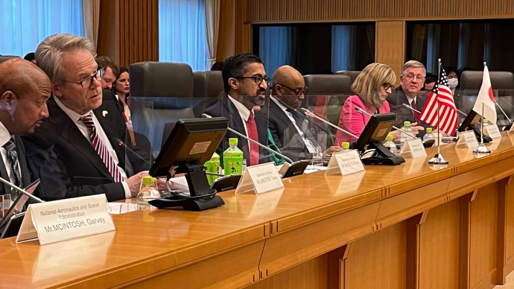 Richard DalBello (2nd from left) and other U.S. delegates in action at the conference table with mics and flags